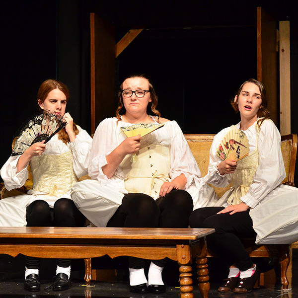 A photo of cast members in the fall play, "Tartuffe."